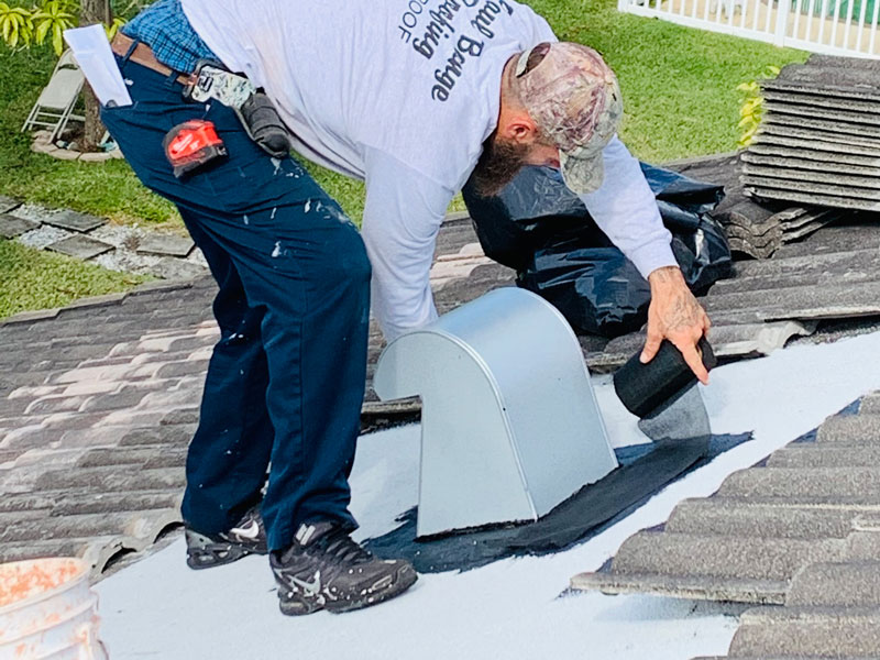 man repairing roof