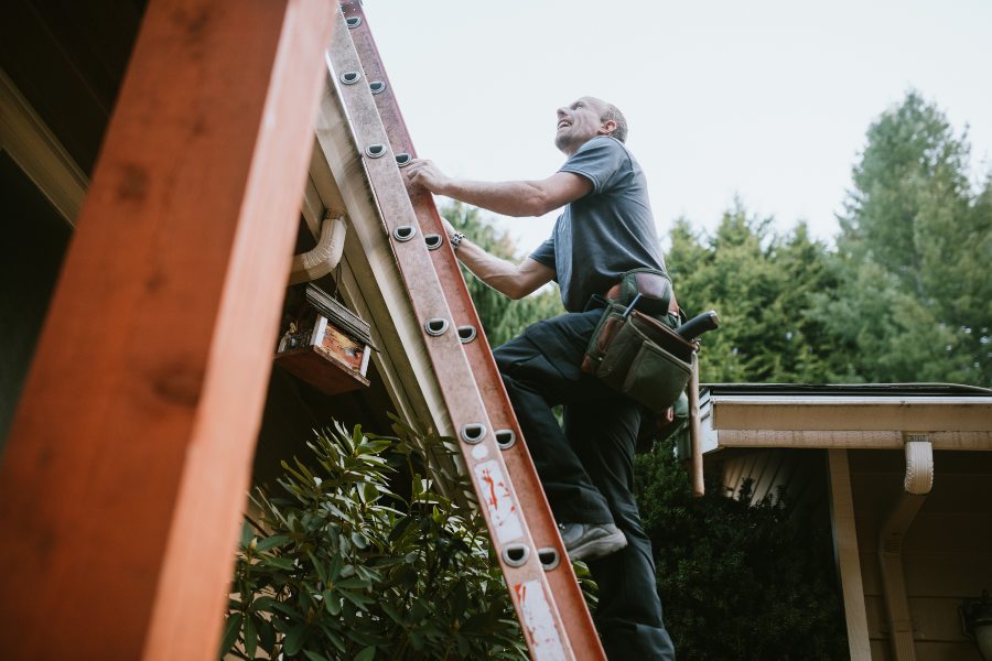 Paul Bange Roofing Technician Performing Roof Inspections at House in South Florida