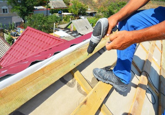A Man Showcasing The Importance of Gutters at Paul Bange Roofing in Florida
