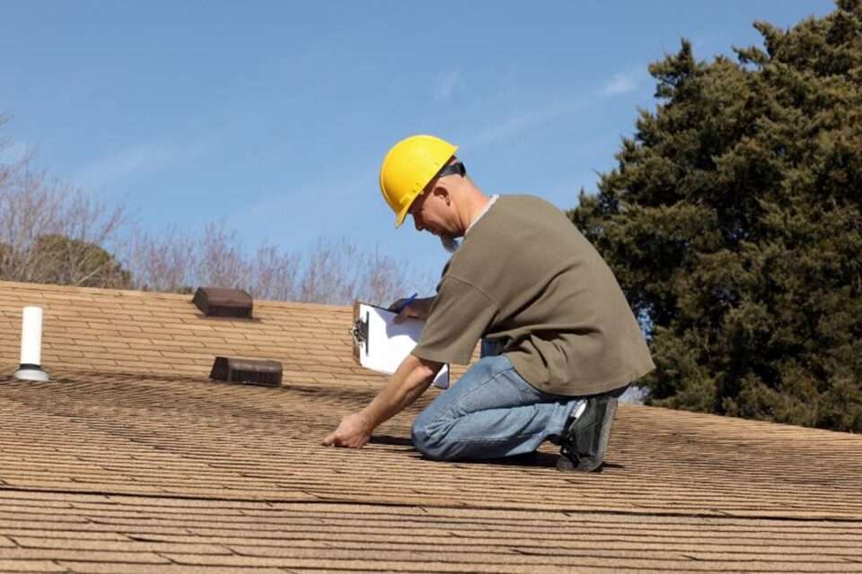 A professional roof inspector in South Florida checks the roof issues.